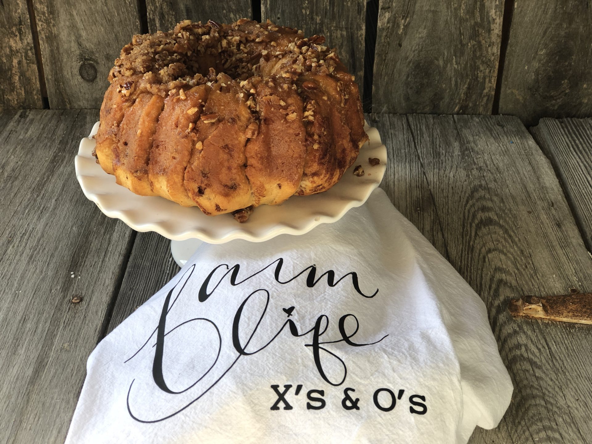 Easy Caramel Cinnamon Roll Bundt Cake from Farmwife Feeds makes a pop can of cinnamon rolls into a delicious easy bundt cake with a caramel glaze and pecans. #cinnamonrolls #bundtcake #easybreakfast