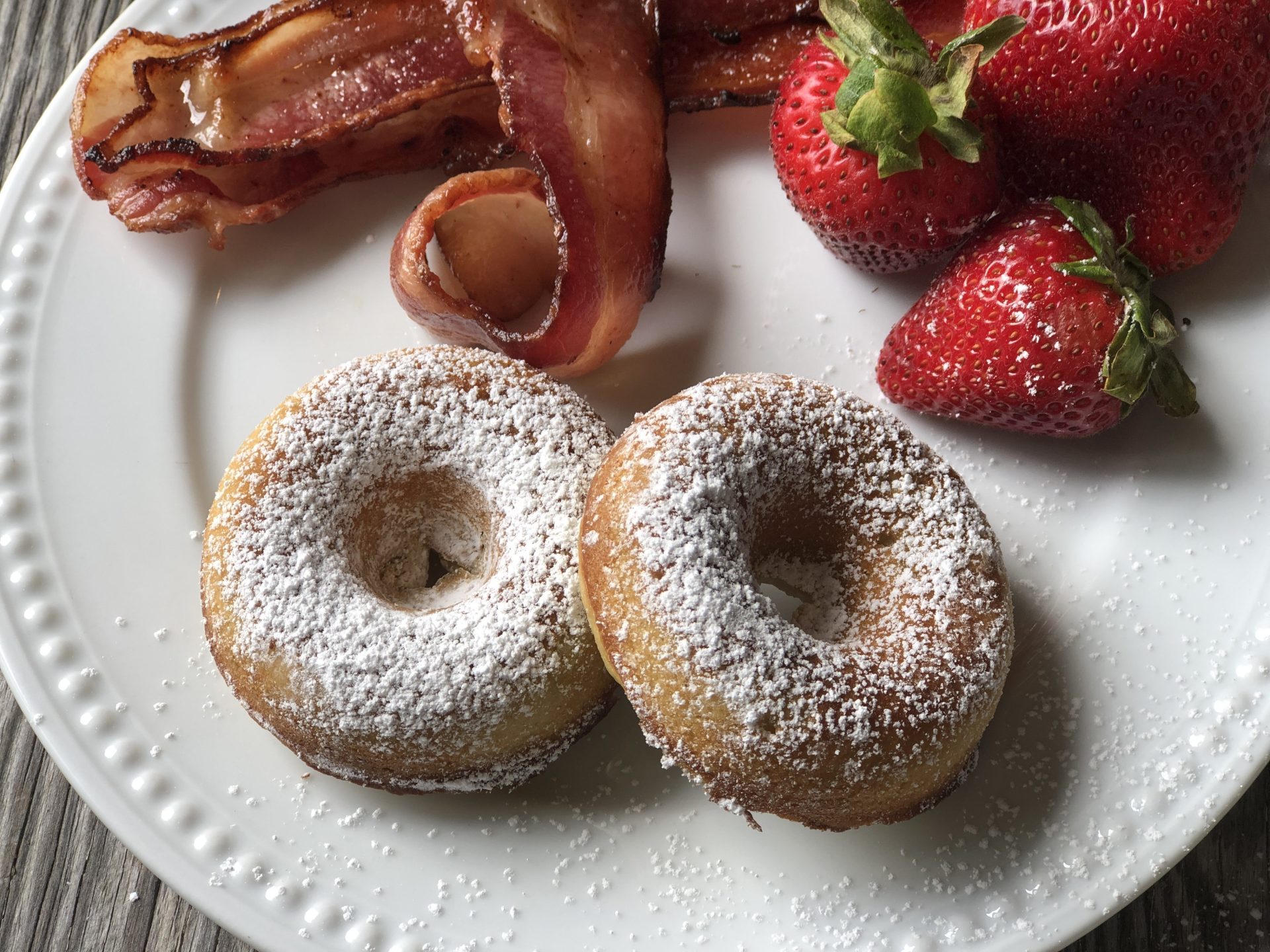 Homemade Rhubarb Donuts from Farmwife Feeds are super simple ingredients for a fresh baked donut full of rhubarb flavor that makes a great treat. #donut #homemade #bakeddonut #rhubarb